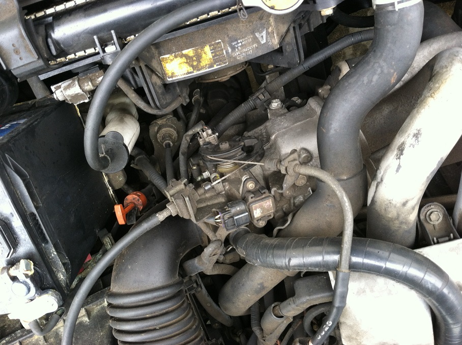 car's engine and transmission under the hood