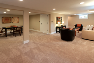 basement with carpeting, living and dining rooms