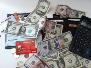 money, credit and debit cards and calculator