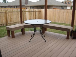 a deck with benches and a table