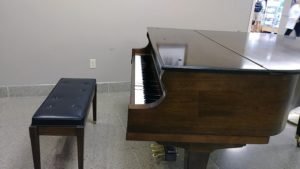 grand piano with bench
