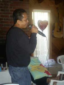 man singing a song on microphone