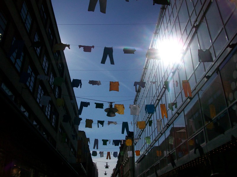 drying clothes on clothes line between buildings.