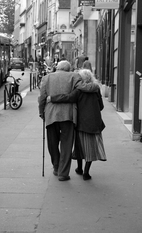 elderly man and woman taking a walk