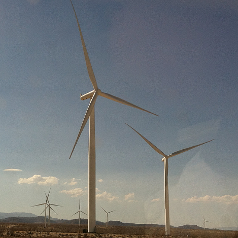 windmills in a desert field