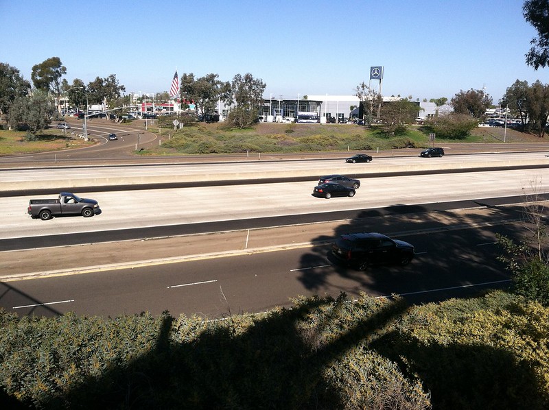 cars and trucks driving on the freeway